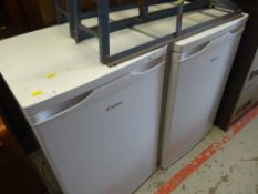 An upright Candy freezer and similar fridge