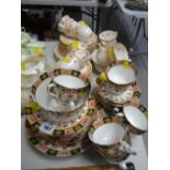 A quantity of mixed tea ware in two patterns