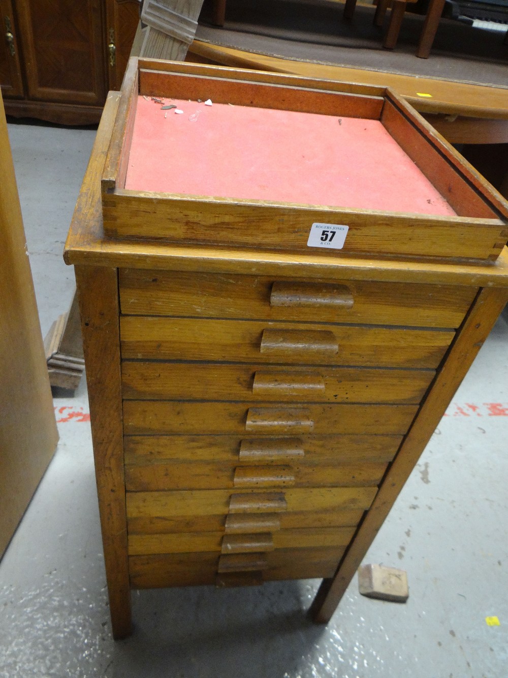 A vintage eleven-drawer specimen cabinet with display case top