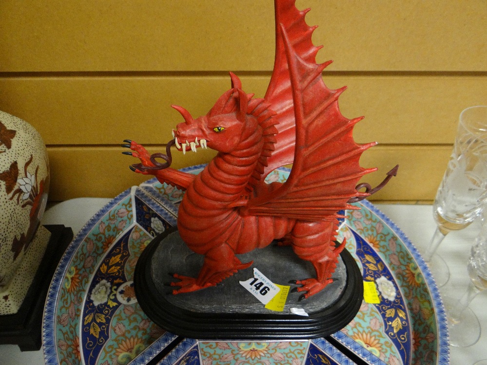 A painted pottery Welsh dragon on a stand by Ballantynes