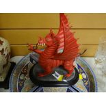 A painted pottery Welsh dragon on a stand by Ballantynes