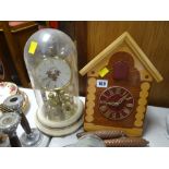 A cuckoo-type clock and a dome clock