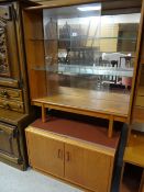 A teak sliding door bookcase and a similar retro teak cupboard