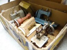 Five miniature sewing machines etc