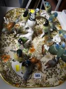 A quantity of continental porcelain and Staffordshire porcelain garden birds