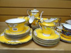 A quantity of vintage Duchess china tea ware in yellow ground with floral decoration