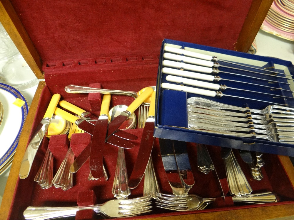 A canteen of cutlery and a boxed set of knives and forks