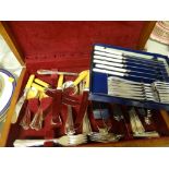 A canteen of cutlery and a boxed set of knives and forks