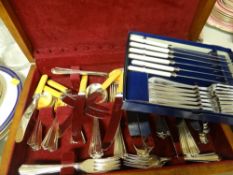 A canteen of cutlery and a boxed set of knives and forks