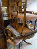 A Bevan Funnell 'Reprodux' furniture extending drum-type dining table in mahogany with one leaf