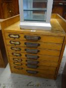 A vintage seven-drawer office filing system