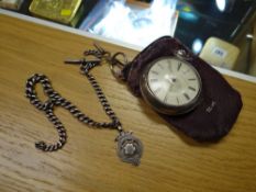 A silver open faced pocket watch (Fishguard) with removable protective case, shaped glass & key toge