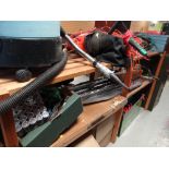 A garage shelving unit and extensive contents including Bosch trimmer, garden blower, tools, mower