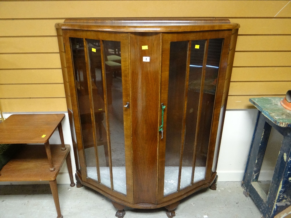 A vintage polished two-door china cabinet