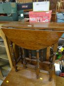 A neat small drop leaf gate-leg table