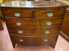 A LATE GEORGIAN MAHOGANY BOW FRONT CHEST of two short over three long drawers having cockbeaded