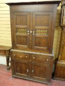 A WELSH ANTIQUE OAK BREAD & CHEESE CUPBOARD, the twin door upper section with pierced fretwork