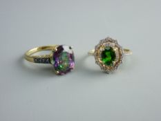 A NINE CARAT GOLD DIOPSIDE & DIAMOND CLUSTER DRESS RING and a nine carat gold dress ring with oval