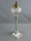 A VICTORIAN SILVER PLATED OIL LAMP BASE with glass font, Corinthian column with ram's head and