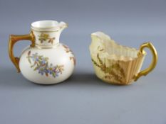 TWO ROYAL WORCESTER BLUSH & GILT DECORATED JUGS, both with typical palettes of floral sprays,