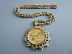 A 1980 FULL GOLD SOVEREIGN & MOUNT with a nine carat gold muff chain, total 23 grms