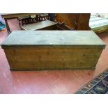 A LARGE ANTIQUE PINE LIDDED BOX with iron carry handles, 61 cms high, 173 cms wide, 61 cms deep