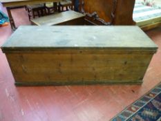 A LARGE ANTIQUE PINE LIDDED BOX with iron carry handles, 61 cms high, 173 cms wide, 61 cms deep
