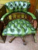 AN ANTIQUE STYLE CAPTAIN'S CHAIR in green button back leather effect upholstery, with a curved