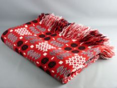 A RED GROUND TRADITIONAL WELSH WOOLLEN BLANKET, 232 x 160 cms