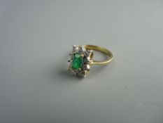A NINE CARAT GOLD EMERALD & DIAMOND CLUSTER DRESS RING, visual estimate of the oblong cut emerald
