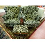 A PAIR OF REPRODUCTION WINGBACK ARMCHAIRS in the Victorian style in a black and light gold