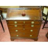 A GEORGIAN MAHOGANY FALL FRONT BUREAU, the drop down crossbanded fall opening to reveal an