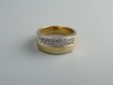A NINE CARAT GOLD PAVE RING having two rows of ten tiny diamonds each, 6.5 grms total, O fitting