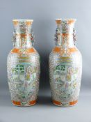A LARGE PAIR OF 19th CENTURY CHINESE PORCELAIN VASES with profuse Famille Vert decoration and panels