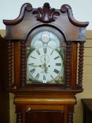 A VICTORIAN MAHOGANY LONGCASE CLOCK by S Bibby, Carnarvon, the painted arched dial set with Roman