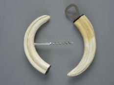 A VINTAGE BOTTLE OPENER & CORKSCREW SET with boar's tusk handles