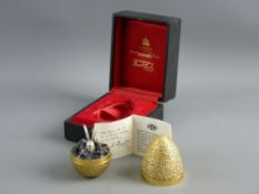 STUART DEVLIN SILVER GILT NOVELTY SURPRISE EGG, the textured body opening to reveal a large eared