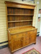 A COUNTRY OAK & PINE FARMHOUSE DRESSER, the three shelf wide boarded rack with blind spice drawers