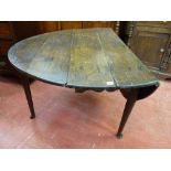 AN ANTIQUE OAK DROP LEAF PAD FOOT DINING TABLE, 72 cms high, 124 cms long, 48.5 cms wide (closed)