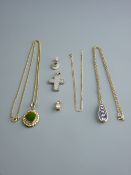 A PARCEL OF FIVE, MAJORITY NINE CARAT GOLD PENDANTS, two with fine chains and including a crucifix