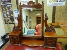 A LATE VICTORIAN MAHOGANY DRESSING MIRROR having dual banks of three small drawers with turned