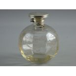 A SILVER TOPPED & ETCHED GLASS PERFUME BOTTLE, the hinged circular lid with interior glass stopper