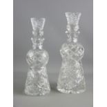 TWO CUT GLASS THISTLE SHAPED DECANTERS with stoppers, 32.5 cms and 30 cms high, (the larger with