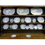 A TWENTY PIECE WILLOW PATTERN DRESSER SET to include three meat platters as displayed on Lot 19