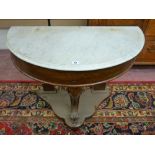 A VICTORIAN MAHOGANY WASHSTAND BASE with semi-circular white marble top and carved central leg
