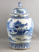 A LARGE BLUE & WHITE CHINESE TEMPLE JAR & COVER, the bulbous body decorated with an all over
