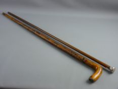 AN 1898 FOLK ART CARVED WALKING STICK and a Malacca and silver topped cane, the stick carved with