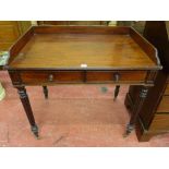 A VICTORIAN MAHOGANY TWO DRAWER SIDE TABLE, the rectangular top and three quarter gallery with