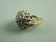 A TEN CARAT GOLD DIAMOND RING with large floral cluster of tiny diamonds, 5.3 grms, N fitting