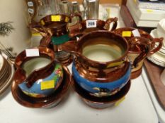 A parcel of copper lustre jugs etc